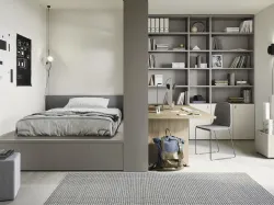 Cameretta componibile con letto su cassettone, scrivania e ampia libreria Next space 02 di Nidi