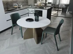 Tavolo rotondo Wing con piano in ceramica bianco con struttura bronzo di Zamagna